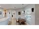 Cozy dining area with tile floors, a pendant light, and large window with natural light at 1855 Sugar Cove Ct, Ocoee, FL 34761