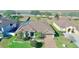 Beautiful single Gathering home featuring mature landscaping, attached two car garage, and brick paved driveway at 1855 Sugar Cove Ct, Ocoee, FL 34761