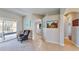 Hallway featuring tile flooring and wall art, seamlessly connecting the home's interior spaces at 1855 Sugar Cove Ct, Ocoee, FL 34761