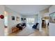 Cozy living room with neutral walls, carpet, and a sliding glass door to the backyard at 1855 Sugar Cove Ct, Ocoee, FL 34761