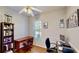 Office room with wooden floors, a window for natural light, and a built-in bookshelf at 1855 Sugar Cove Ct, Ocoee, FL 34761