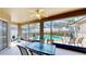 Enclosed patio with furniture, exercise equipment, and a view of the pool area at 1855 Sugar Cove Ct, Ocoee, FL 34761