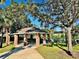 Community pavilion featuring brick columns, picnic tables, and mature shade trees at 1855 Sugar Cove Ct, Ocoee, FL 34761