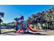 Community playground with colorful slides, climbing structures, and safe play area at 1855 Sugar Cove Ct, Ocoee, FL 34761