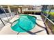 Beautiful kidney-shaped pool inside screened enclosure offers a refreshing escape at 1855 Sugar Cove Ct, Ocoee, FL 34761