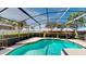 Inviting pool surrounded by a screened enclosure and manicured hedges at 1855 Sugar Cove Ct, Ocoee, FL 34761