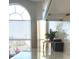 Bright kitchen area featuring white cabinets and quartz countertops with a view from a large window at 1879 Spruce Ridge Dr, Orlando, FL 32808