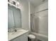 Clean bathroom with bathtub, shower, and white vanity at 2058 Derwent Dr, Davenport, FL 33896