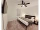 Bedroom with king bed, ceiling fan, and mounted TV at 2058 Derwent Dr, Davenport, FL 33896