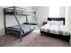 Bedroom with a bunk bed and a full-size bed at 2058 Derwent Dr, Davenport, FL 33896