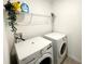 Laundry room with washer, dryer, and shelving at 2058 Derwent Dr, Davenport, FL 33896
