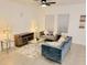 Living Room with gray couch, glass coffee table, and wooden media console at 2058 Derwent Dr, Davenport, FL 33896