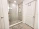 Large walk-in shower with gray tile surround at 2058 Derwent Dr, Davenport, FL 33896