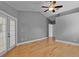 Spacious bedroom featuring hardwood floors and a ceiling fan at 2073 Shadyhill Ter, Winter Park, FL 32792