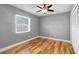 Bright bedroom with wood floors and spacious closets at 2073 Shadyhill Ter, Winter Park, FL 32792