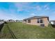 Spacious backyard with grassy area and privacy fence at 2128 Silver Brook Way, Davenport, FL 33837