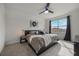 Spacious bedroom with large windows, carpeted floor, and a ceiling fan at 2128 Silver Brook Way, Davenport, FL 33837