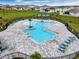Resort-style community pool with plenty of space for relaxing at 2128 Silver Brook Way, Davenport, FL 33837