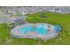 Community pool with a splash pad and plenty of lounge chairs at 2128 Silver Brook Way, Davenport, FL 33837