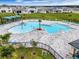 Relaxing community pool with shaded seating areas at 2128 Silver Brook Way, Davenport, FL 33837