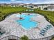 Resort-style community pool with plenty of lounge chairs at 2128 Silver Brook Way, Davenport, FL 33837