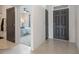Bright entryway with tile flooring, leading to bedrooms and a living area at 2128 Silver Brook Way, Davenport, FL 33837