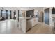 Modern kitchen with island, stainless steel appliances, and granite countertops at 2128 Silver Brook Way, Davenport, FL 33837