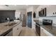 Modern kitchen with stainless steel appliances and granite countertops at 2128 Silver Brook Way, Davenport, FL 33837
