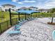 Poolside lounge chairs under shaded canopies at 2128 Silver Brook Way, Davenport, FL 33837