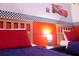Cars-themed bedroom with twin beds and nightstand at 227 Verona Ave, Davenport, FL 33897