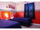 Twin bedroom with Cars theme, featuring two beds and nightstands at 227 Verona Ave, Davenport, FL 33897