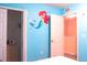 Bedroom with mermaid-themed wall and closet at 227 Verona Ave, Davenport, FL 33897