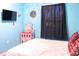 bedroom with a bed, TV, and whimsical decor at 227 Verona Ave, Davenport, FL 33897