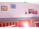 Cars-themed bedroom wall with framed prints and decals at 227 Verona Ave, Davenport, FL 33897