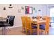 Light and airy dining area with wood table and six chairs at 227 Verona Ave, Davenport, FL 33897