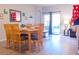 Dining area with wood table and access to backyard patio at 227 Verona Ave, Davenport, FL 33897
