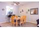 Dining area with kitchen pass-through and hardwood floors at 227 Verona Ave, Davenport, FL 33897