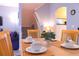 Close up of dining table set for four with white dishes at 227 Verona Ave, Davenport, FL 33897