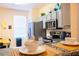 Modern kitchen with stainless steel appliances and granite countertops at 227 Verona Ave, Davenport, FL 33897