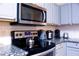 Stainless steel appliances and granite countertops highlight this modern kitchen at 227 Verona Ave, Davenport, FL 33897