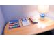 Wooden side table with lamp and travel brochures at 227 Verona Ave, Davenport, FL 33897