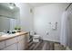 Simple bathroom with shower and tub, vanity, and vinyl flooring at 2300 Butterfly Palm Way # 205, Kissimmee, FL 34747