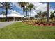 Community clubhouse with landscaping and palm trees at 2300 Butterfly Palm Way # 205, Kissimmee, FL 34747