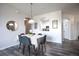 Dining area with table and chairs, kitchen pass-through at 2300 Butterfly Palm Way # 205, Kissimmee, FL 34747