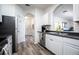 White kitchen with stainless steel appliances and dark counters at 2300 Butterfly Palm Way # 205, Kissimmee, FL 34747