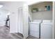 Laundry closet with washer, dryer, and shelving at 2300 Butterfly Palm Way # 205, Kissimmee, FL 34747