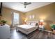 Spacious main bedroom with large bed, wood floors, and plenty of light at 2300 Butterfly Palm Way # 205, Kissimmee, FL 34747