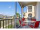 Relaxing screened balcony with table and chairs, overlooking green space at 2300 Butterfly Palm Way # 205, Kissimmee, FL 34747