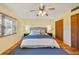 Bright main bedroom with wood-look flooring, ceiling fan and plenty of natural light at 2626 S Atlantic Ave # 102, Daytona Beach Shores, FL 32118