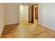 Spacious bedroom featuring wood floors and a walk-in closet for ample storage at 2626 S Atlantic Ave # 102, Daytona Beach Shores, FL 32118